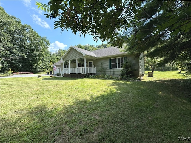 view of front facade with covered porch and a front yard