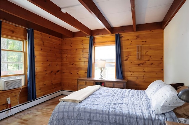 bedroom featuring cooling unit, wooden walls, light hardwood / wood-style flooring, a baseboard radiator, and beam ceiling