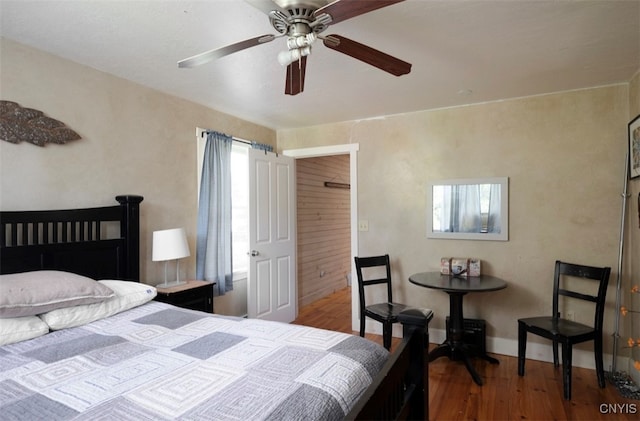 bedroom with ceiling fan and hardwood / wood-style flooring