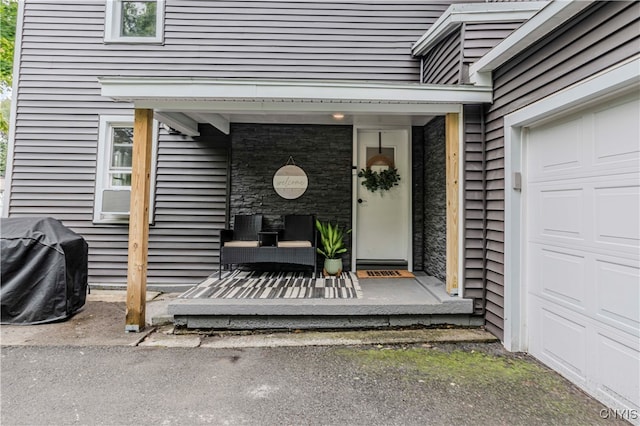 property entrance with a garage