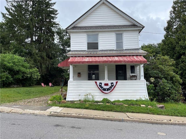 view of front of property with a front lawn and a porch