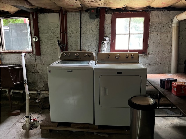 laundry area with plenty of natural light and washer and dryer