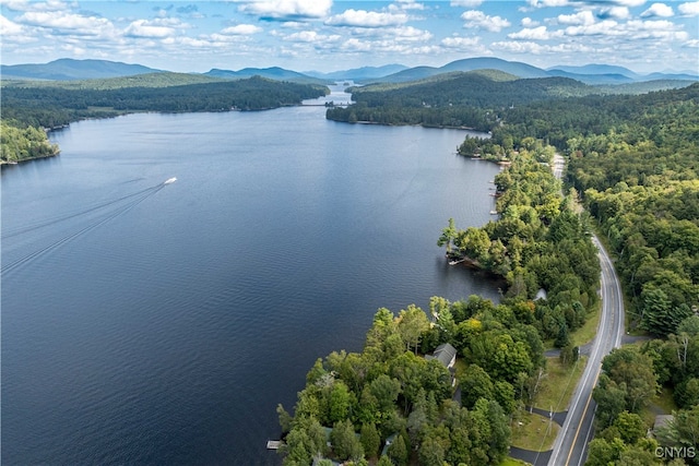 aerial view featuring a water and mountain view