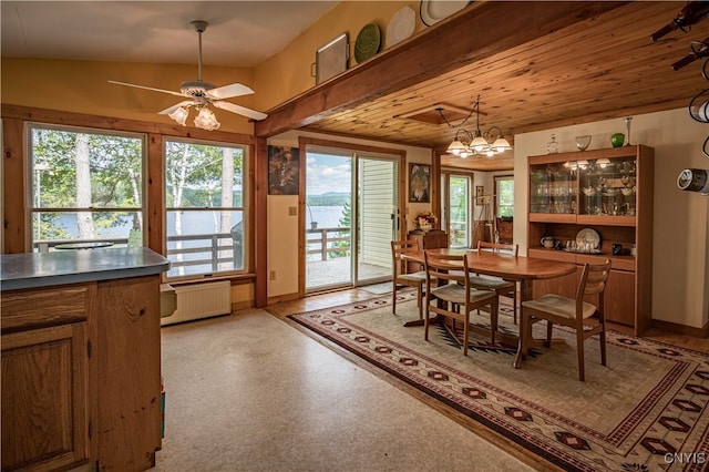 dining room with radiator heating unit, wood ceiling, lofted ceiling, and ceiling fan with notable chandelier