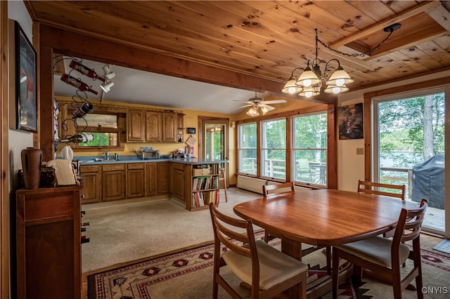 carpeted dining area featuring wooden ceiling, ceiling fan with notable chandelier, and a wealth of natural light