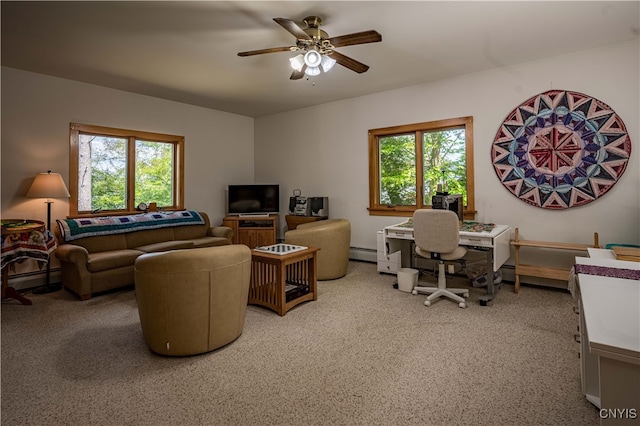 living room with carpet flooring, baseboard heating, and ceiling fan