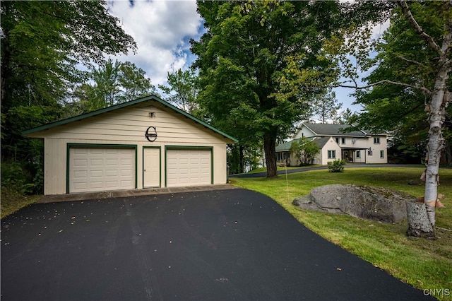 garage featuring a yard