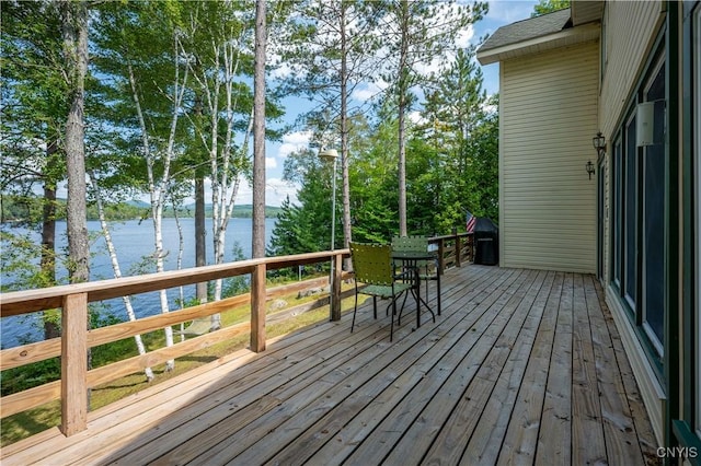 deck featuring a water view