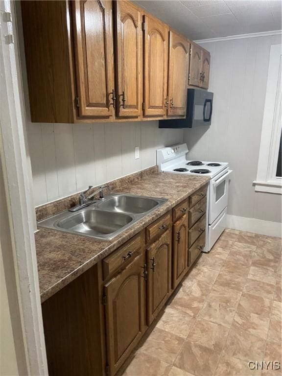 kitchen featuring white electric range oven, baseboards, brown cabinetry, black microwave, and a sink