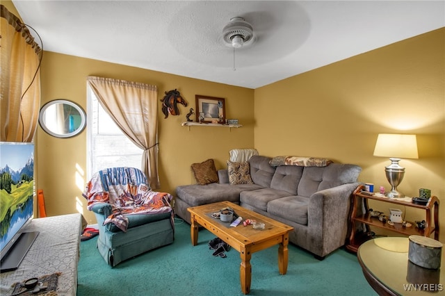 carpeted living room featuring ceiling fan