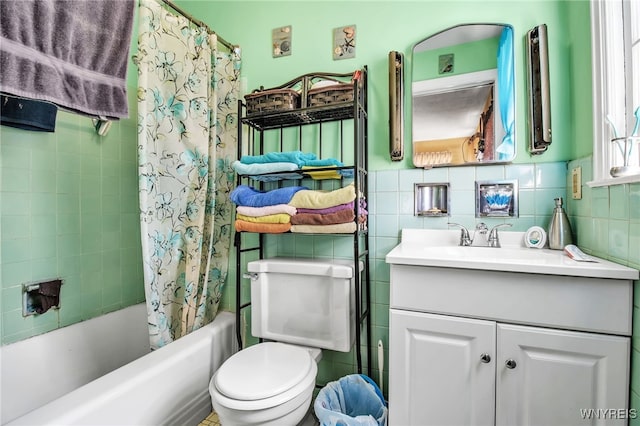 full bathroom featuring shower / bath combo, toilet, tile walls, decorative backsplash, and vanity