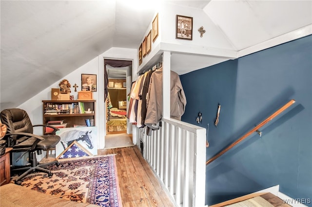 bonus room with lofted ceiling and light hardwood / wood-style flooring