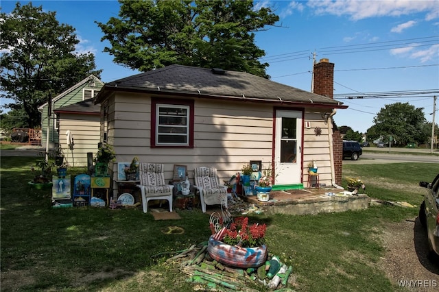 back of house with a yard