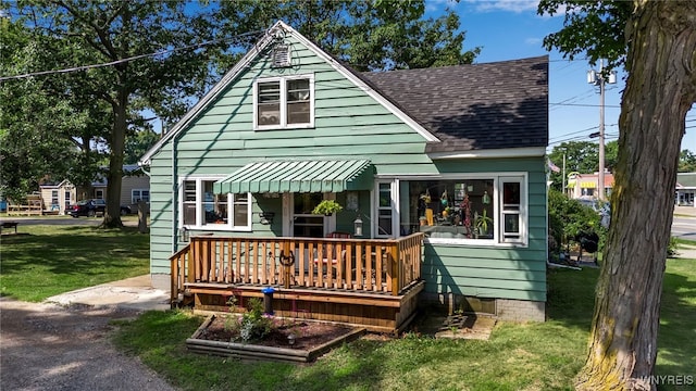 rear view of house with a lawn