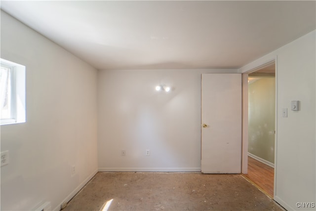 empty room with baseboards