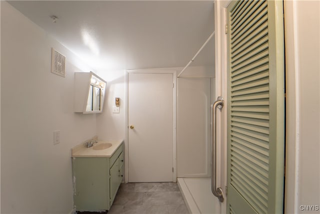 bathroom with visible vents and vanity