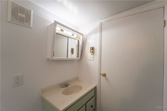 bathroom with visible vents and vanity