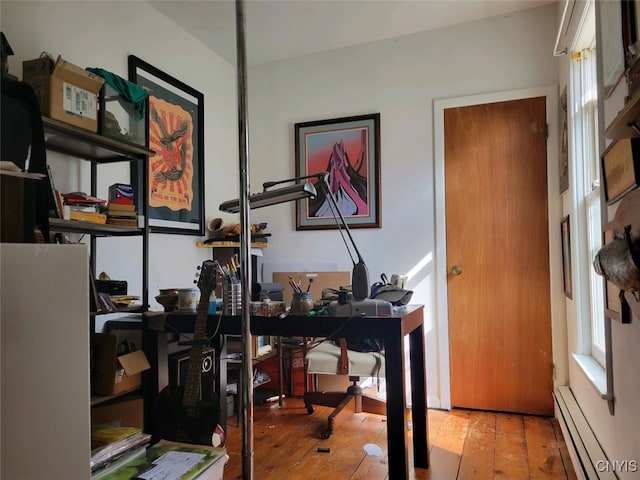 office space featuring light hardwood / wood-style flooring and a baseboard radiator