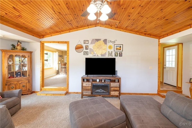 living room with lofted ceiling, carpet, wooden ceiling, and baseboards