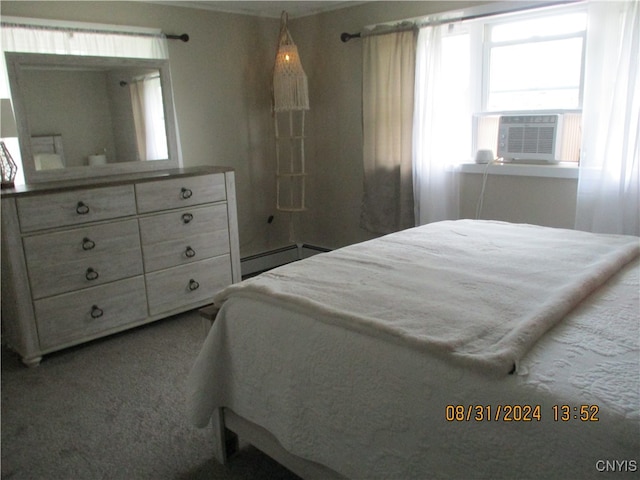 bedroom with cooling unit, baseboard heating, and carpet floors