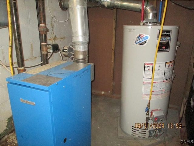 utility room with a heating unit and gas water heater