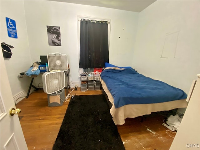 bedroom with wood-type flooring