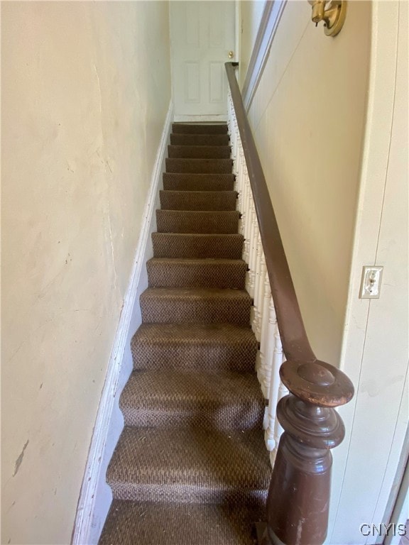 staircase featuring hardwood / wood-style floors