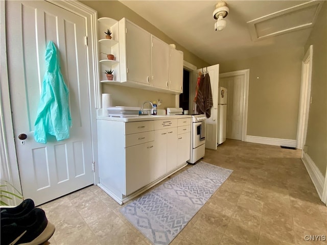 kitchen featuring light tile patterned floors, white appliances, and white cabinets