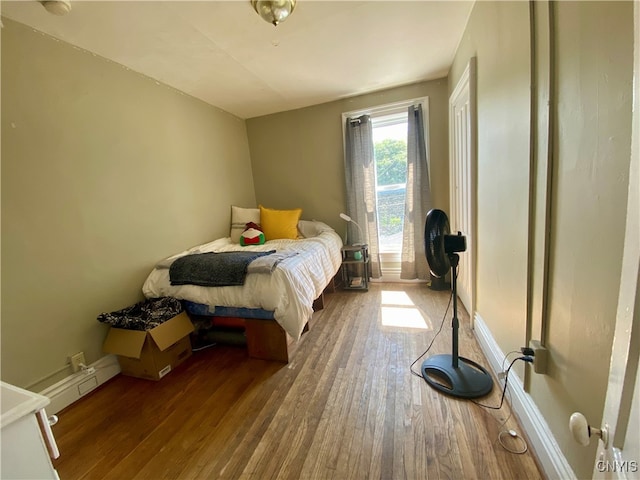 bedroom featuring dark hardwood / wood-style flooring