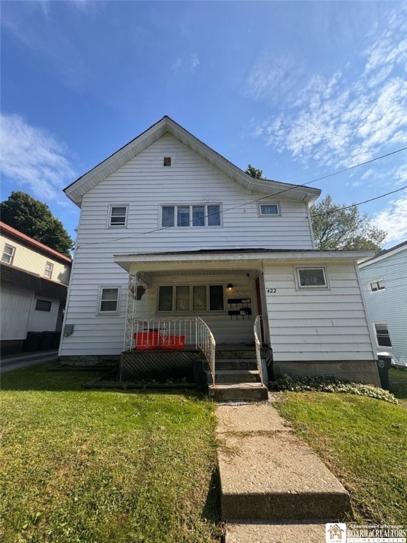 view of front facade with a porch and a front lawn