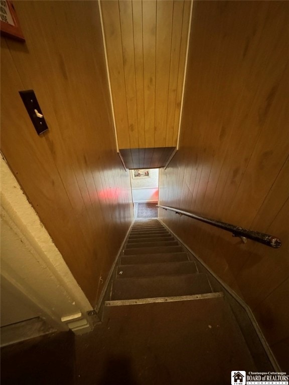 stairway featuring wooden ceiling