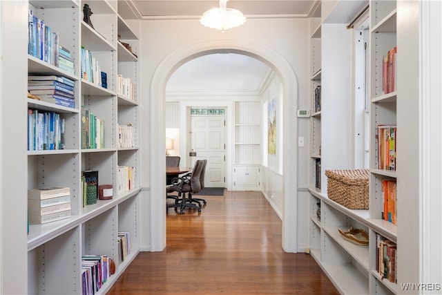 corridor featuring crown molding and wood-type flooring