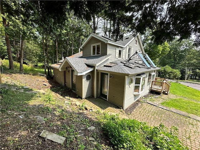 exterior space with a shingled roof