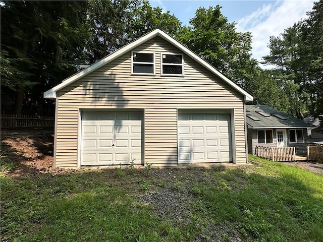 garage with fence