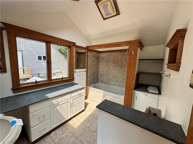 full bathroom featuring lofted ceiling and shower / bath combination