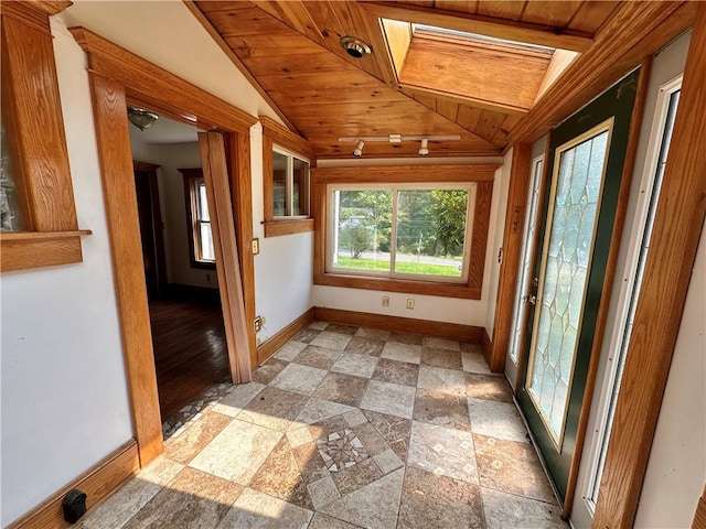 unfurnished sunroom with wood ceiling and vaulted ceiling