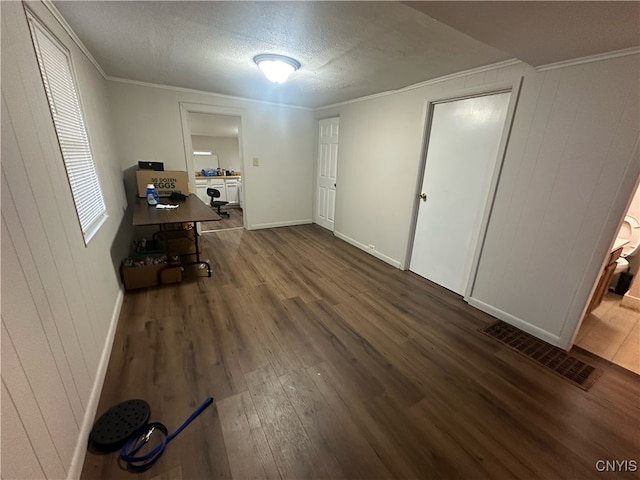 interior space with ornamental molding and dark hardwood / wood-style flooring