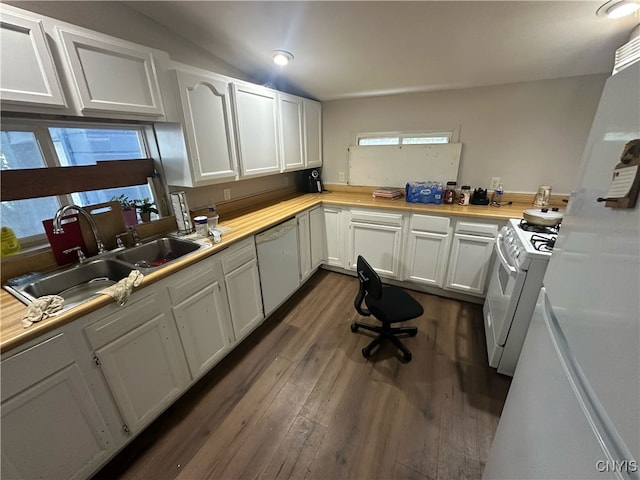 kitchen with white appliances, white cabinetry, sink, lofted ceiling, and dark wood-type flooring