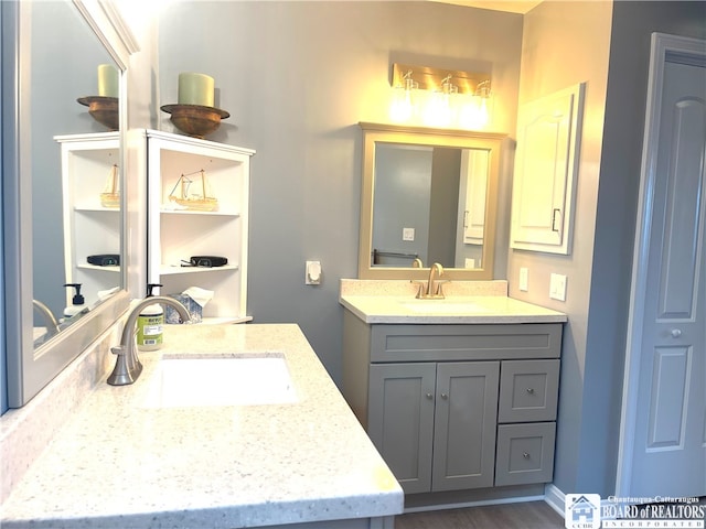 bathroom with vanity and hardwood / wood-style floors