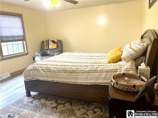 bedroom featuring wood-type flooring and ceiling fan