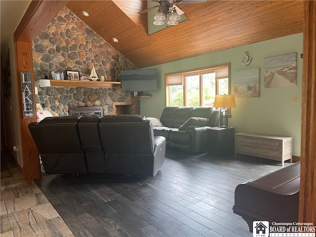 living room with wooden ceiling, a stone fireplace, dark hardwood / wood-style floors, and ceiling fan