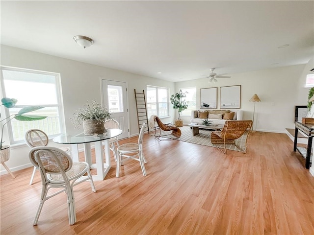 dining space featuring light hardwood / wood-style flooring and ceiling fan