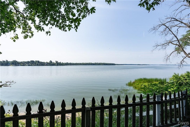 view of water feature with fence