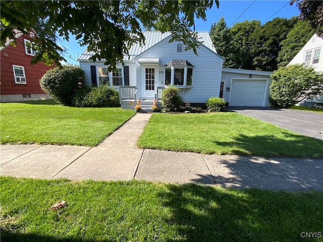 view of front facade featuring a garage and a front lawn