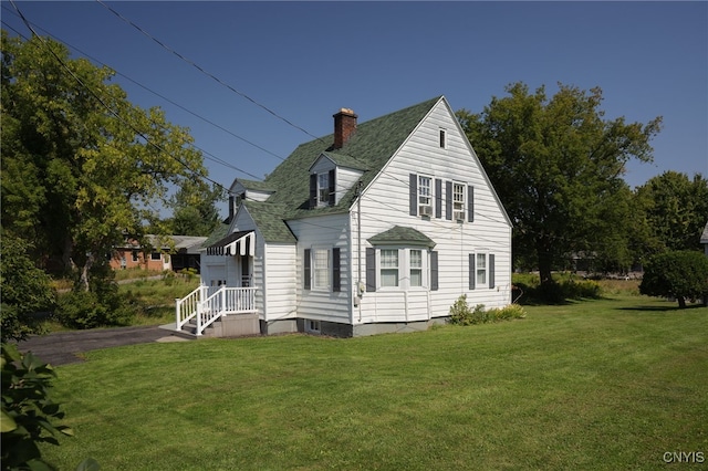 view of home's exterior featuring a yard