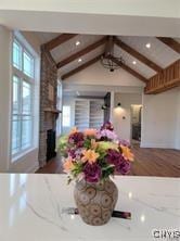 interior space featuring beam ceiling, a fireplace, and recessed lighting