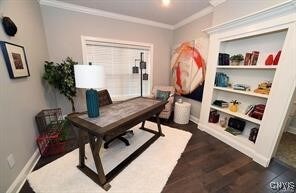 office space featuring dark hardwood / wood-style floors and crown molding