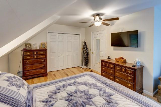1090 Park Hill Rd, Colchester, NY 13755 - bedroom featuring ceiling fan, baseboards, light wood finished floors, and a closet