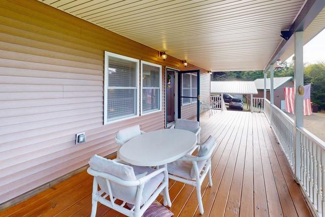 1090 Park Hill Rd, Colchester, NY 13755 - wooden terrace featuring outdoor dining space