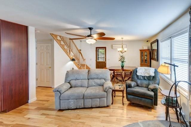 1090 Park Hill Rd, Colchester, NY 13755 - living area featuring stairs, ceiling fan with notable chandelier, and light wood-style floors